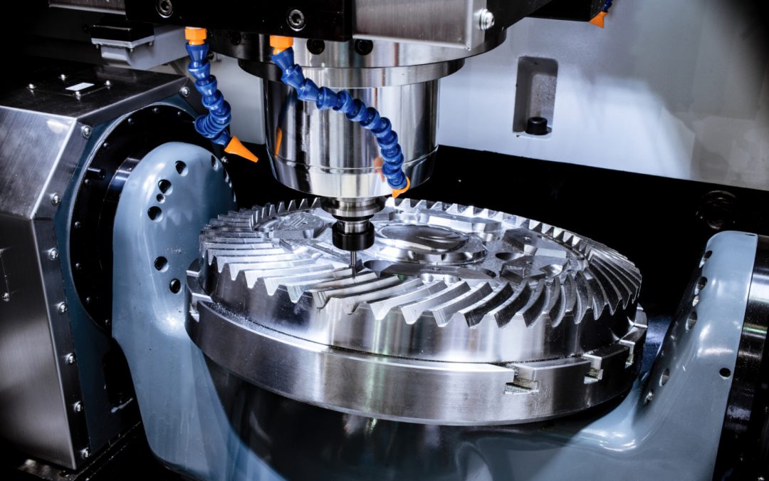 A CNC machine milling a large, metallic gear with precision tools and coolant hoses.